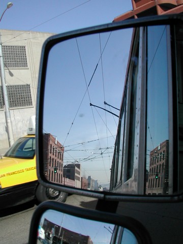 Similar, but from a different viewpoint.  One does not normally drive with the mirrors adjusted to see the overhead...one uses various indicators, sound and vibration in the main, using sight only to confirm when needed.